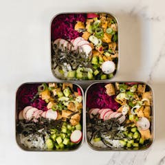 Marinated Tofu Poke Bowl in a metal meal prep container