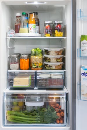 A fridge stocked with prepared meals.